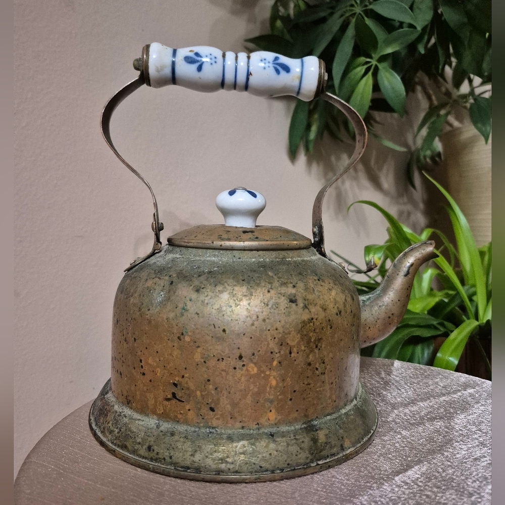 Vintage brass kettle with porcelain handles